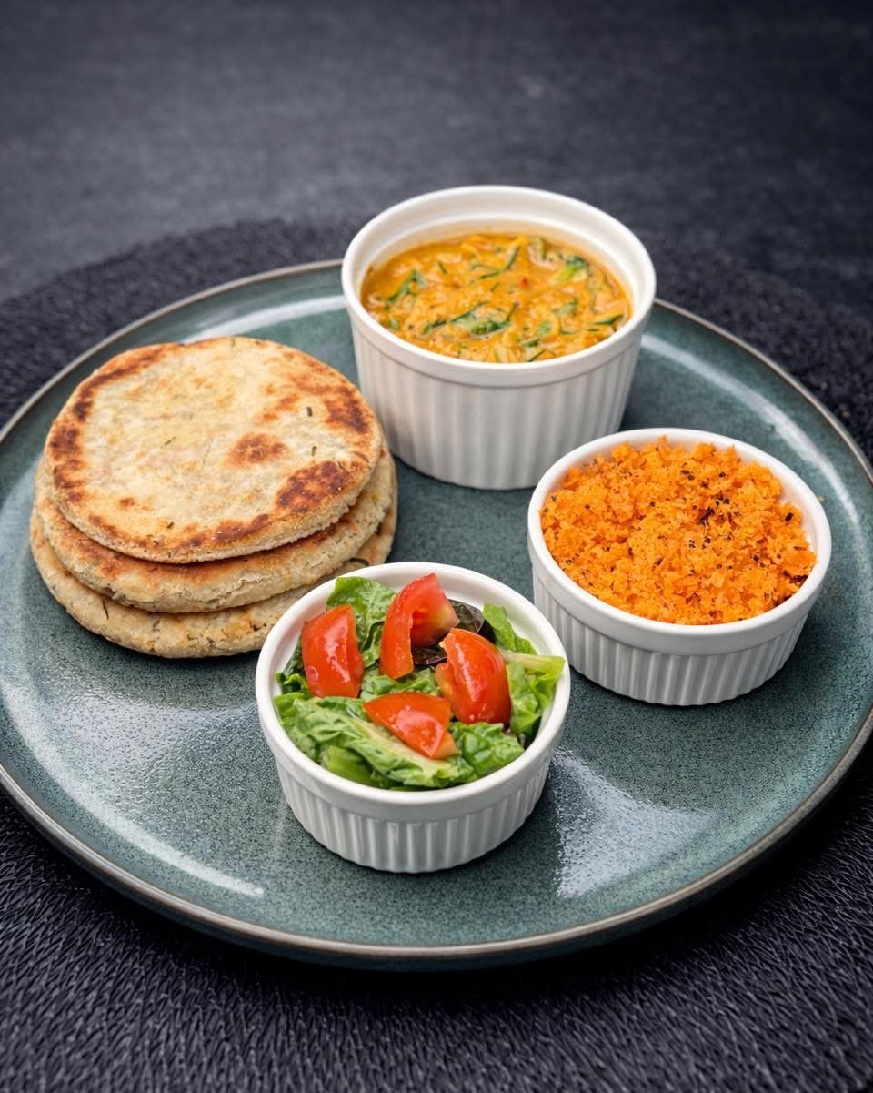 Roti, dhal and coconut sambol served with a fresh salad
